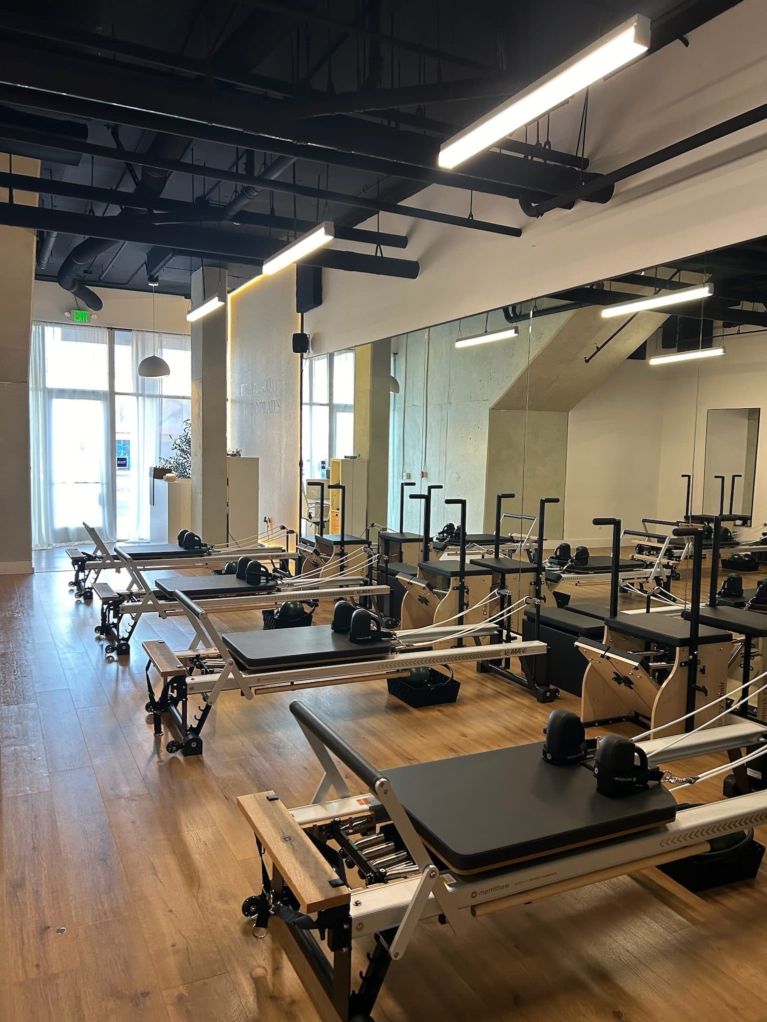 Bright reformer studio with rows of reformers at Bodies and Pilates in North Hollywood