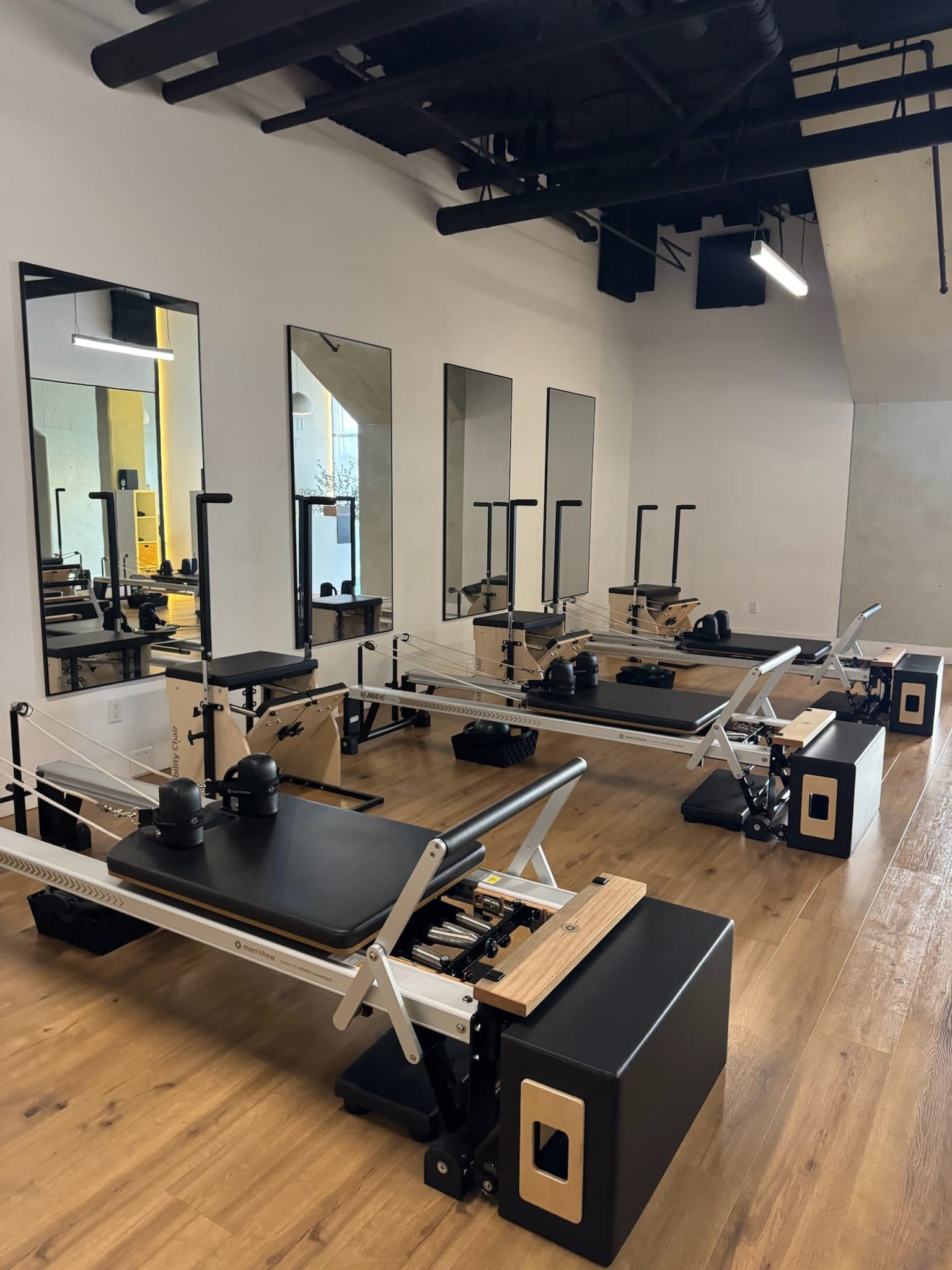 Empty reformer studio ready for class at Bodies and Pilates in North Hollywood